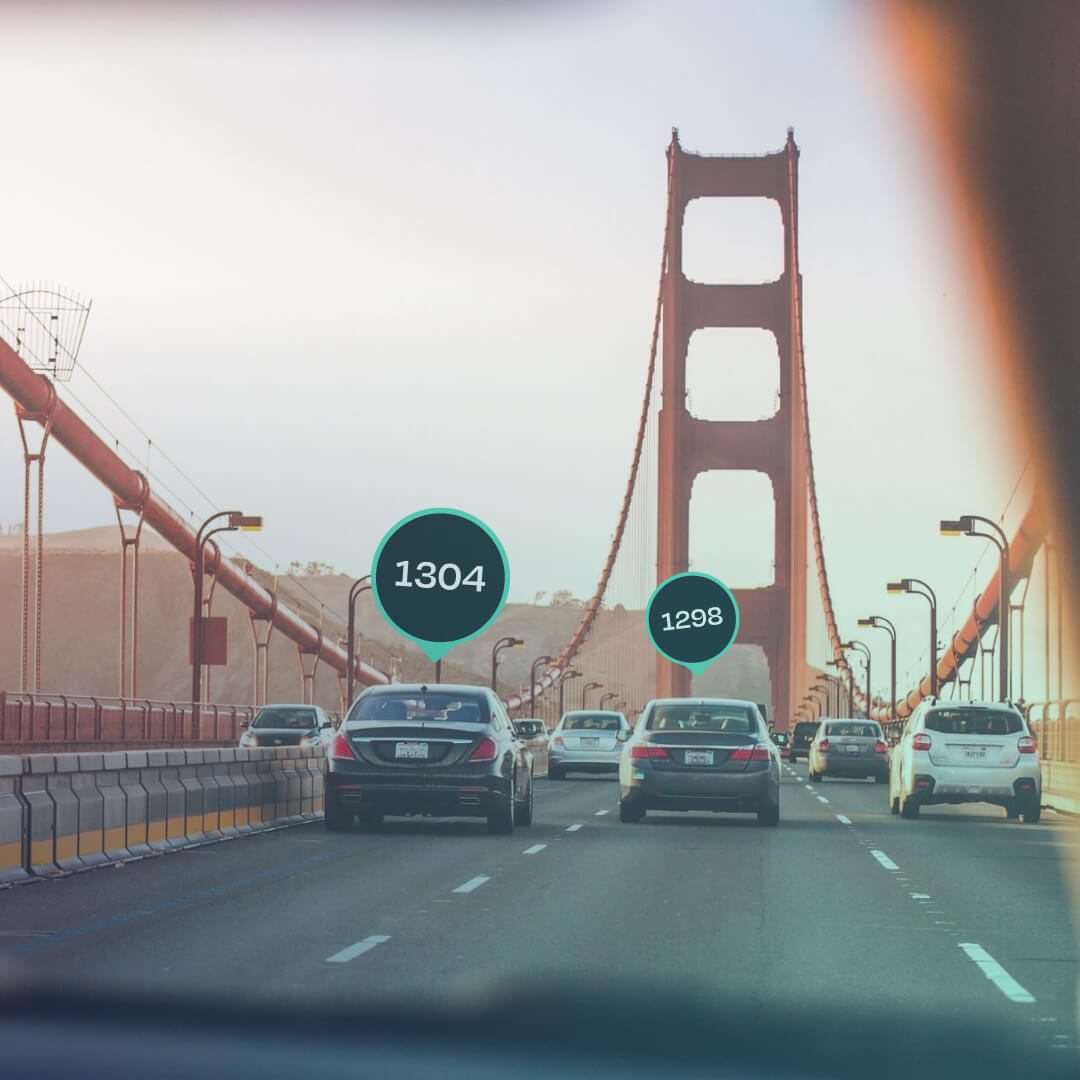 Cars driving on a bridge with FIA SDC markers on top of them