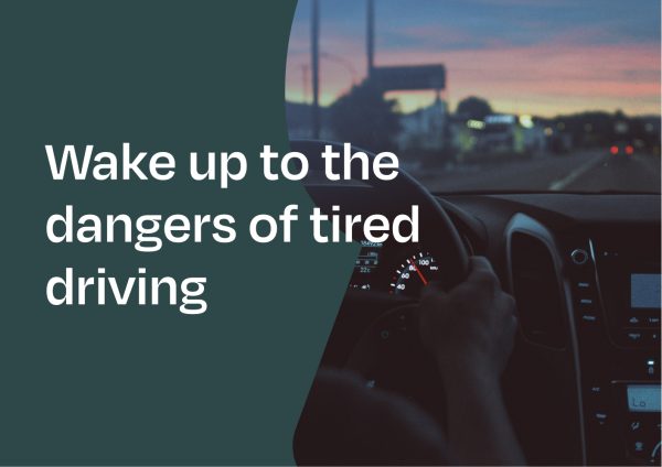 Hands holding a wheel driving a car. Copy on top of image saying 